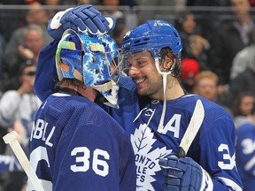 Auston Matthews and Jack Campbell congratulate each other after Matthews 60th goal and Campbell's shutout against the Detroit Red Wings during an NHL game at Scotiabank Arena on April 26, 2022 in Toronto, Ontario, Canada.