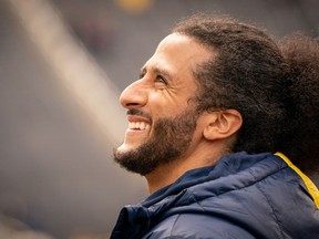 Colin Kaepernick interacts with fans during the Michigan spring football game at Michigan Stadium on April 2, 2022 in Ann Arbor, Michigan. Kaepernick was honorary captain for the game.