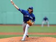 Starting pitcher Kevin Gausman #34 of the Toronto Blue Jays throws against the Boston Red Sox during the second inning at Fenway Park on April 21, 2022 in Boston, Massachusetts.