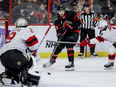 Ottawa Senators right wing Drake Batherson (19) shoots on New Jersey Devils goaltender Mackenzie Blackwood (29) in the first period at the Canadian Tire Centre on April 26, 2022.