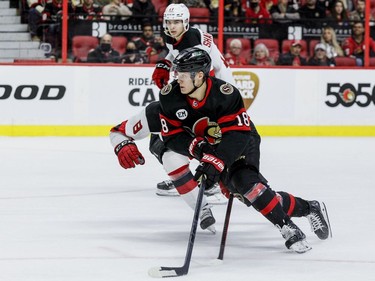 Ottawa Senator Tim Stuetzle (18) gets past New Jersey Devils defenceman Reilly Walsh (8) in the first period at the Canadian Tire Centre on April 26, 2022.