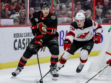 Ottawa Senators left wing Alex Formenton (10) moves the puck against New Jersey Devils left wing Nolan Foote (25) in the first period at the Canadian Tire Centre on Tuesday night.