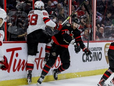 Ottawa Senators left wing Austin Watson (16) checks New Jersey Devils defenceman Damon Severson (28) in the third period.