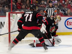 Senators centre Chris Tierney (71) looks on as goalie Mads Sogaard (33) makes a save in the first period against the Winnipeg Jets at the Canadian Tire Centre on Sunday night.