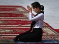 In this file photo taken July 19, 2019, Aung San Suu Kyi takes part in the Martyrs' Day ceremony in Yangon.