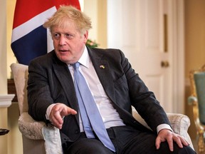 British Prime Minister Boris Johnson speaks during a meeting with Switzerland's President Ignazio Cassis at 10 Downing Street in London, Thursday, April 28, 2022.