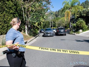 A Yellow Police tape blocks access to the 1100 block of Maytor place where Jacqueline Avant's house is at the top of the hill, in Beverly Hills, California on December 1, 2021.