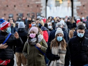 People wear masks amid the COVID-19 pandemic in Milan, Nov. 28, 2021.