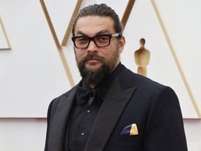 Jason Momoa poses on the red carpet during the Oscars arrivals at the 94th Academy Awards in Hollywood March 27, 2022.