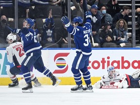Maple Leafs' Michael Bunting celebrates with teammate Auston Matthews after scoring against Washington Capitals goalie Ilya Samsonov in the first period at Scotiabank Arena on Thursday, April 14, 2022.