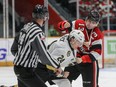 Ottawa 67’s Tyler Boucher (right) and Kingston Frontenacs’ Thomas Budnick go toe-to-toe at TD Place on April 15, 2022.