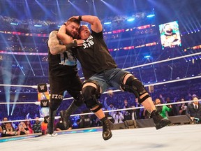 Stone Cold Steve Austin delivers a Stunner to Kevin Owens near the end of their ‘impromptu’ no-holds-barred match 
at WrestleMania 38 on April 2, 2022, in Arlington, Tex.