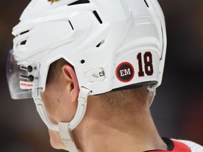 The helmet of Senators centre Tim Stutzle bears one of the stickers placed in memory of team owner Eugene Melnyk, who died last Monday, during Tuesday's road game against the Predators in Nashville. Patches will also be on the jerseys of Senators players for the rest of this season.