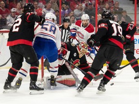 Ottawa Senators goalie Anton Forsberg (31) makes a save in front of Montreal Canadiens defenceman David Savard (58) in the first period at the Canadian Tire Centre.