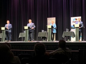 From left: Ontario Liberal Leader Steven Del Duca, Progressive Conservative Leader Doug Ford, NDP Leader Andrea Horwath and Green Party Leader Mike Schreiner take the stage Tuesday in the first leaders' debate of the provincial campaign, held at the Capitol Centre in North Bay, Tuesday, May 10, 2022.