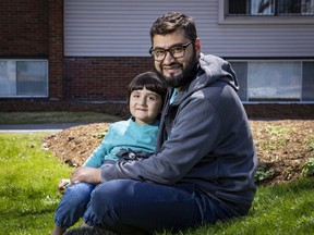 Rustam with his son. Rustam, a physician who has worked as public health advisor to the Afghan government, is working on his long-term goal of getting his Canadian medical licence.