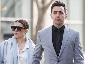 Canadian musician Jacob Hoggard arrives alongside his wife, Rebekah Asselstine, for his sex assault trial at the Toronto courthouse on Tuesday, May 10, 2022.