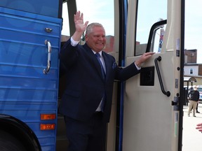 Ontario PC party leader Doug Ford waves from his bus as he arrives at the Federation of Northern Ontario Municipalities debate held at the Capitol Centre in North Bay, Ont. on Tuesday, May 10,2022.