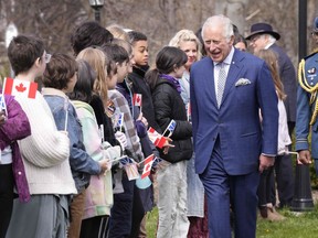 Prince Charles, Prince of Wales, greets onlookers in St. John's as the royal couple arrives for a visit to Canada on May 17, 2022.