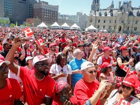 FILE PHOTO: Canadians celebrate during Canada Day festivities on Parliament Hill in Ottawa on July 1, 2019.