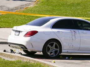 Toronto Police investigate after one man was killed and another wounded by gunfire in a parking lot at Morningside Rd. and Sheppard Ave. E. on Saturday, May 7, 2022.