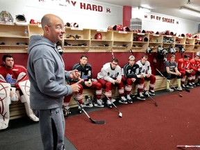 FILES: Former TSN hockey analyst Pierre McGuire speaks to Montreal Juniors in their locker room during a break in practice in 2010.  McGuire has been fired from the Ottawa Senators organization.