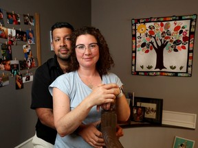 Rohit Saxena and Lesley Spencer pose for a photo in Ottawa Tuesday. The couple lost their six month old baby to SIDS in 2016.