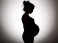 Silhouette of a pregnant woman.