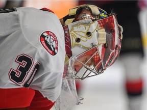 Belleville Senators goalie Filip Gustavsson bows his head during Game 1 against the Rochester Amerks on Wednesday night.