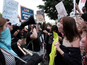 Pro-abortion and anti-abortion demonstrators confront during a protest outside the U.S. Supreme Court after the leak of a draft majority opinion written by Justice Samuel Alito preparing for a majority of the court to overturn the landmark Roe v. Wade abortion rights decision later this year, in Washington, U.S., May 4, 2022.