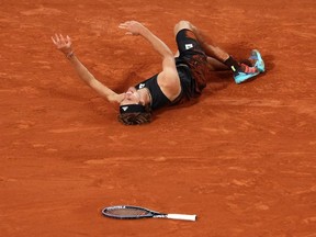 Alexander Zverev of Germany lies injured against Rafael Nadal of Spain during the Men's Singles Semi Final match on Day 13 of The 2022 French Open at Roland Garros on June 03, 2022 in Paris, France.