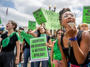 Abortion rights demonstrator Elizabeth White leads a chant in response to the Dobbs v Jackson Women's Health Organization ruling in front of the U.S. Supreme Court on June 24, 2022 in Washington, DC.