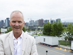 OTTAWA -- Bluesfest executive director Mark Monahan with the festival site behind him at LeBreton Flats. =