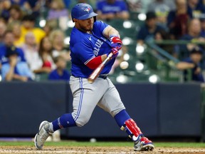 Toronto Blue Jays catcher Alejandro Kirk (30) singles during the fifth inning against the Milwaukee Brewers.