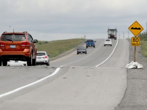 Cars and trucks drive over the "Cavanagh bump" on Highway 7 west of Ottawa.