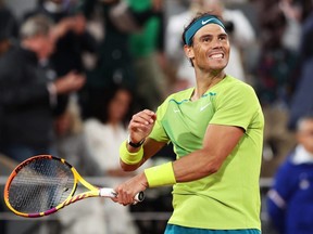 Rafael Nadal celebrates his victory against Novak Djokovic during the men's singles quarterfinal match at the French Open in Paris, Tuesday, May 31, 2022.