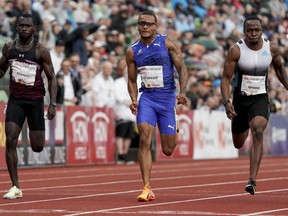 From left, Benjamin Azamati from Ghana, Andre De Grasse from Canada and Akani Simbine from South Africa compete in the men's 100 meters race during the Diamond League Bislett Games, in Oslo, Norway, Thursday, June 16, 2022.