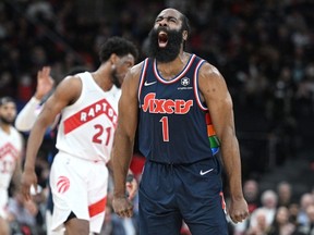 Philadelphia 76ers guard James Harden reacts after making a basket against the Toronto Raptors in the second half during game six of the first round for the 2022 NBA playoffs at Scotiabank Arena.