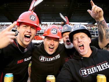 This group of Redblacks fans, left to right, Evan Yourth, Kevin Kennedy, Brian Yourth and Jason Dennis get revved up before the game in the same spot they've had for the past seven CFL seasons.
