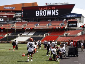 The Cleveland Browns defense takes a break during an NFL football practice at FirstEnergy Stadium, Thursday, June 16, 2022, in Cleveland. The Browns named 33-year-old Montreal native Catherine Raiche as their assistant GM and vice-president of football operations Thursday.