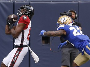 Ottawa Redblacks' Shaq Johnson (88) catches the pass for the touchdown against Winnipeg Blue Bombers' Tyqwan Glass (22) during the first half of CFL action in Winnipeg, Friday, June 10, 2022.