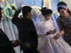 Screen shot from video of groom striking bride in head during wedding reception in Uzbekistan.