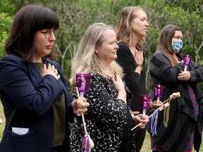 Kirsten Mercer (second from left), a lawyer representing the EVA (End Violence Against Women) Coalition, at the inquest into the Basil Borutski triple murder, which starts today, attends a vigil for the women beforehand.