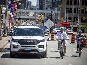 Security screening to access Parliament Hill was removed but a heavy police presence was still visible in the downtown area, Sunday, July 3, 2022. The beautiful weather had tourists and locals out enjoying the weather and sights in Ottawa Sunday.