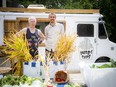 Dr. Barry Bruce (left) of West Carleton Family Health Team and the Deep Roots Food Hub along with Cory Baird and Marhlee Gaudet (not pictured) of Eldon's Pantry and Baird's Chips marked the opening of their open-air food market in Carp on Saturday.