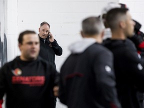 Ottawa Senators general manager Pierre Dorion on the phone while attending the 2022 Ottawa Senators Development Camp.