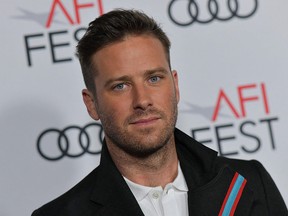 In this file photo taken on Nov. 8, 2018, Armie Hammer arrives for the AFI Opening Night World Premiere Gala Screening of "On the Basis of Sex" at the TCL Chinese theatre in Hollywood.
