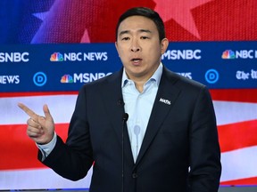 In this file photo taken on Nov. 20, 2019, Democratic presidential hopeful tech entrepreneur Andrew Yang speaks during the fifth Democratic primary debate of the 2020 presidential campaign season co-hosted by MSNBC and The Washington Post at Tyler Perry Studios in Atlanta, Ga.