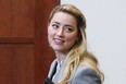 Amber Heard leaves during a break in the courtroom at the Fairfax County Circuit Courthouse in Fairfax, Va., Friday, May 27, 2022.