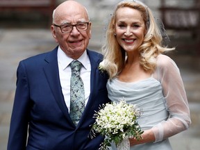Media Mogul Rupert Murdoch and former supermodel Jerry Hall pose for a photograph outside St. Bride's church following a service to celebrate their wedding which took place in London, March 5, 2016.
